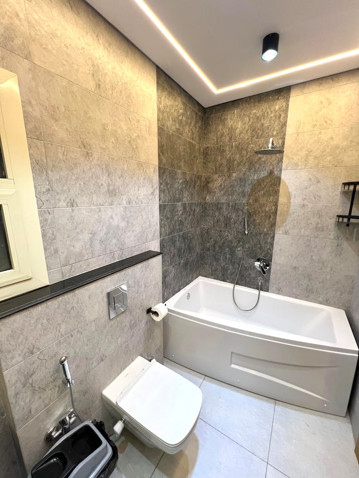 Next to WaterWay Charm Near Mall and Restaurants — Full bathroom 1 in Next to WaterWay, New Cairo, Egypt, Egypt