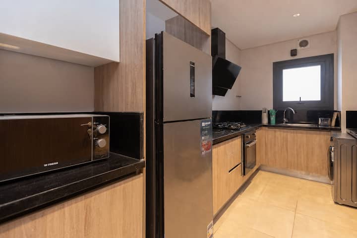 3BR Luxury Apt + Maid Room | Pool Table -Zed West — Full Kitchen in Zed West | El Sheikh Zayed, Egypt — photo 2
