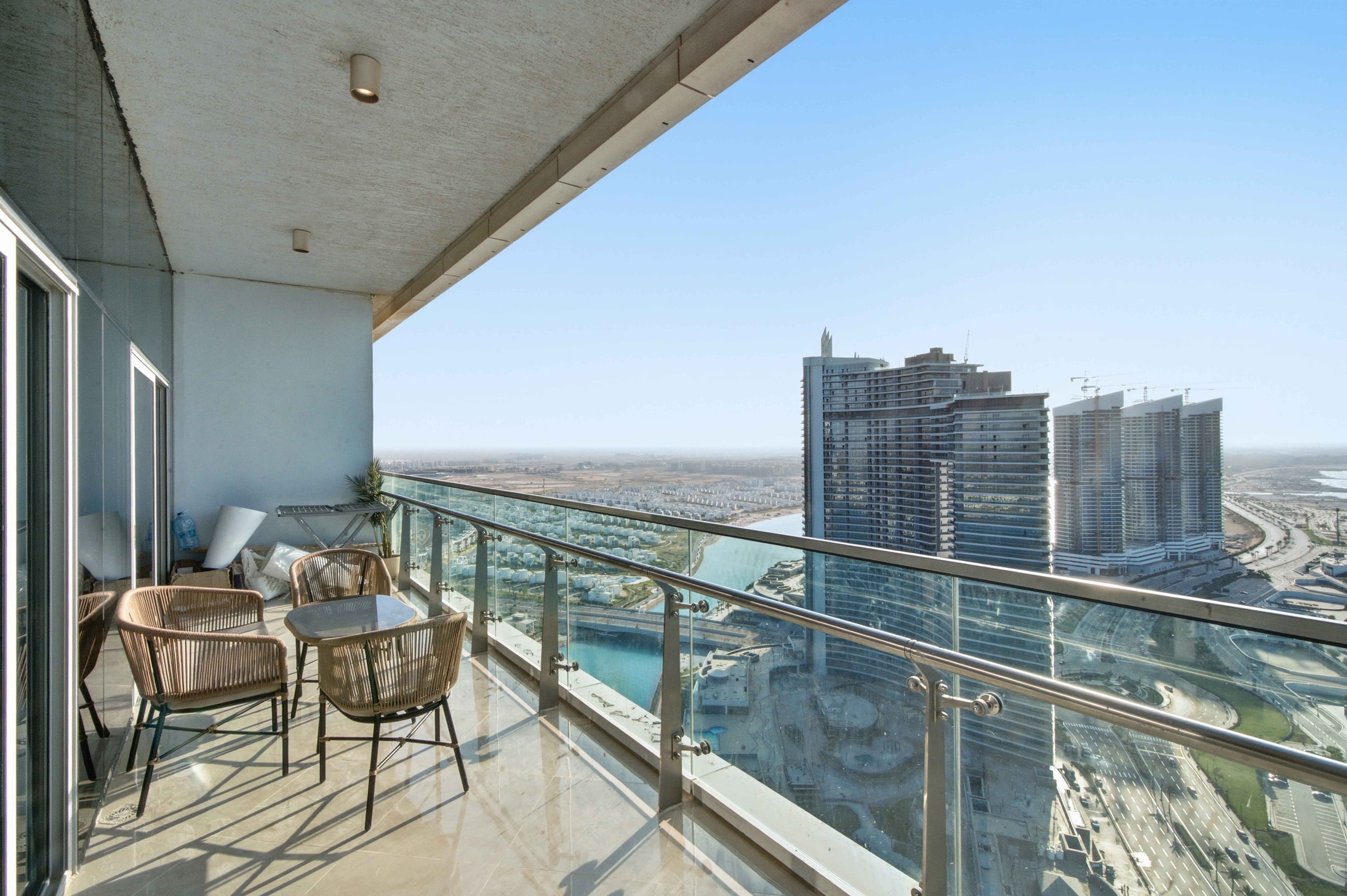 Breezy 1BR Chalet – Sea View – Alamein Towers — Balcony in El Alamen | North Coast, Egypt