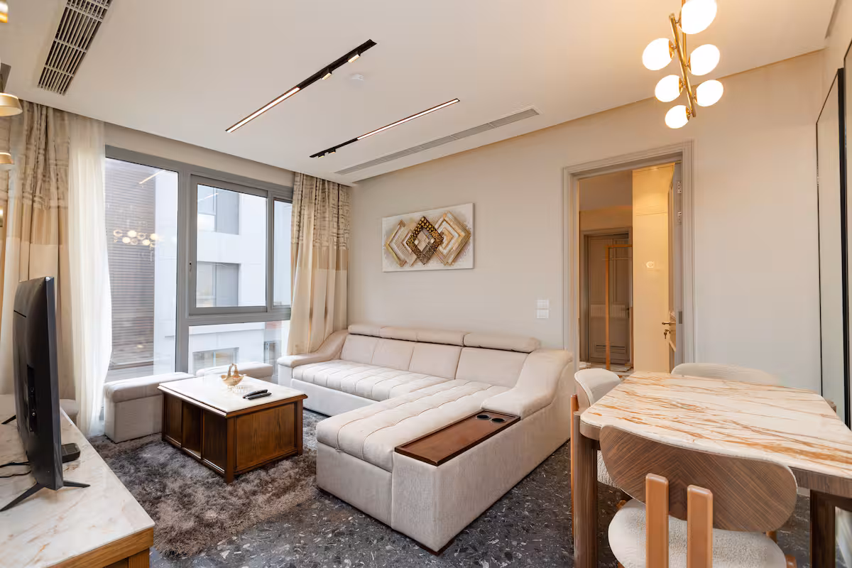 Elegant 1BR Pool View Suite |Aljazi by JW Marriott — Living Room in First New Cairo, Egypt — photo 3