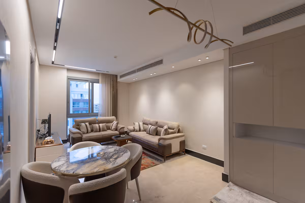 Luxury 1BR Pool View Apt at Al Jazi | JW Marriott — Living Room in New Cairo, Egypt — photo 2