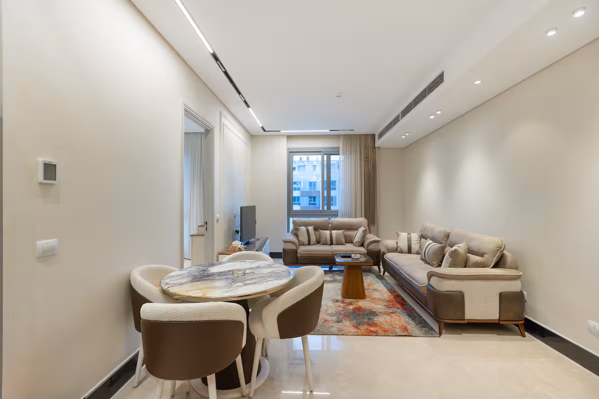 Luxury 1BR Pool View Apt at Al Jazi | JW Marriott — Dining Area in New Cairo, Egypt