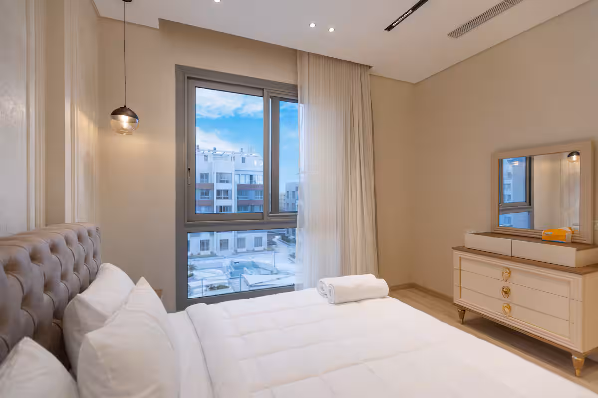 Luxury 1BR Pool View Apt at Al Jazi | JW Marriott — Bedroom 1 in New Cairo, Egypt — photo 2