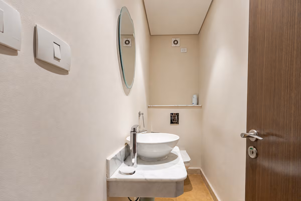 Luxury 3BR Haven Overlooking Green Views -ZED West — Half Bathroom 1 in Sheikh Zayed City, Egypt