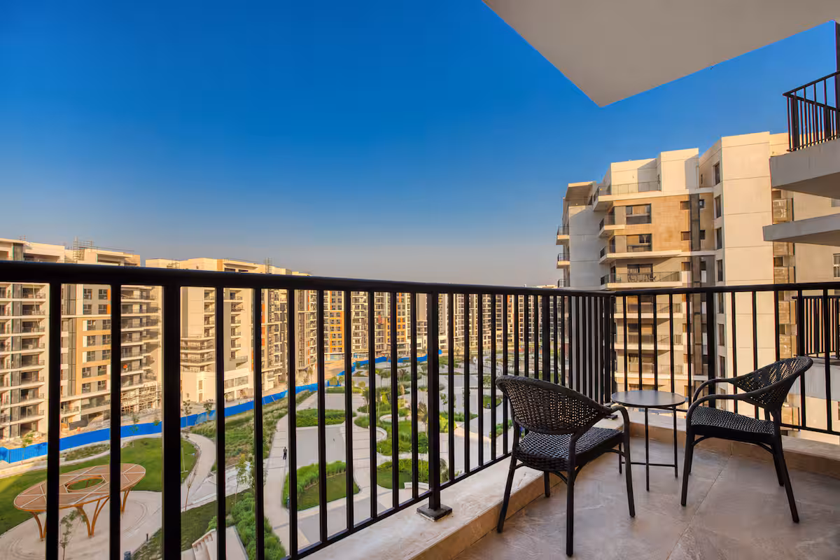 Luxury 3BR Haven Overlooking Green Views -ZED West — Balcony in Sheikh Zayed City, Egypt