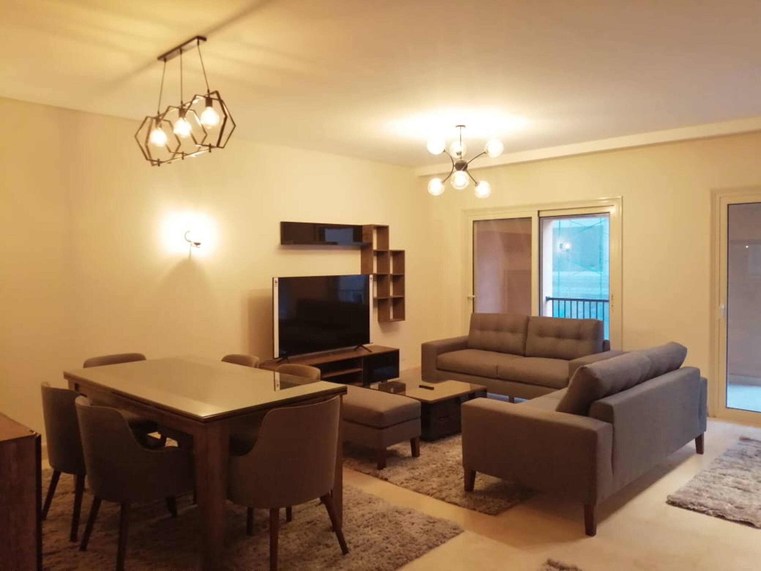 Pool Side New 2-bed Luxury Gated 90 Avenue TBK AUC — Living Room in First New Cairo, Egypt — photo 2