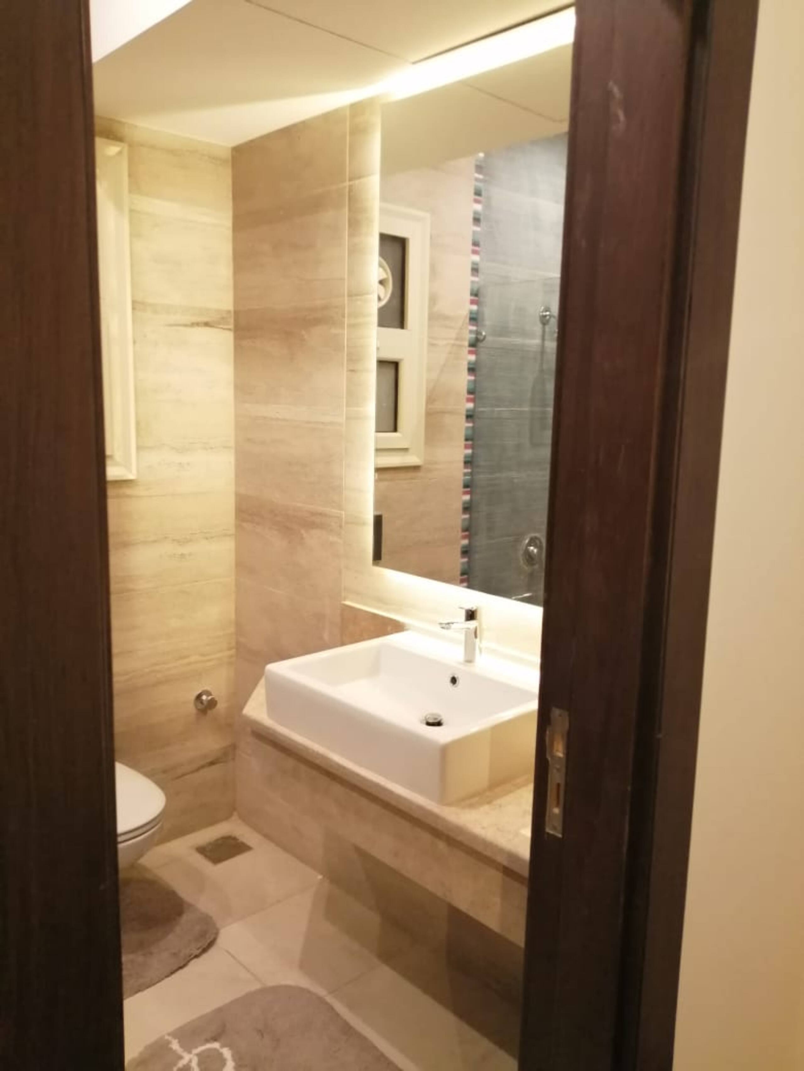 Pool Side New 2-bed Luxury Gated 90 Avenue TBK AUC — Full bathroom 1 in First New Cairo, Egypt