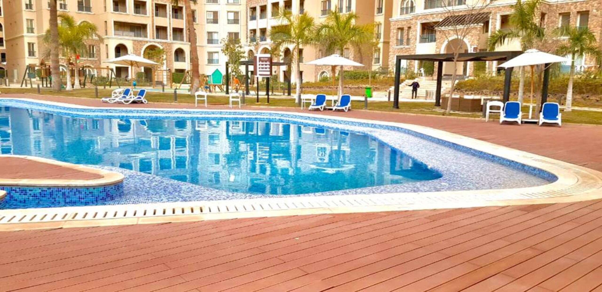 Pool Side New 2-bed Luxury Gated 90 Avenue TBK AUC — Pool in First New Cairo, Egypt — photo 3
