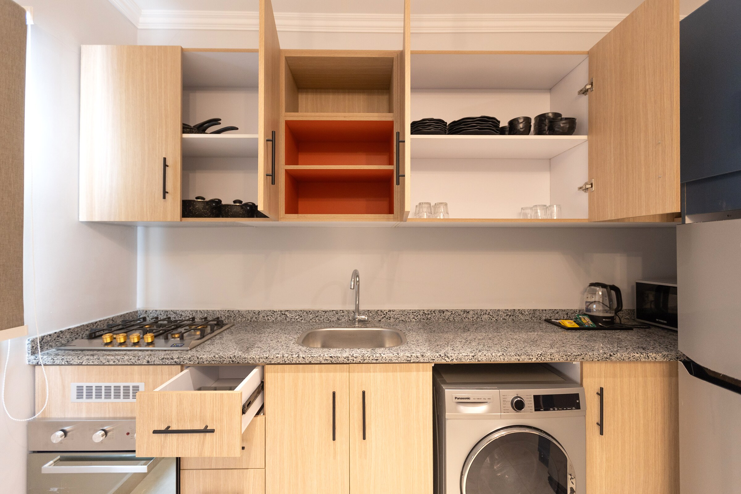 Travelholic Retro Mint 2BR Apartment | Lotus 301 — Full Kitchen in Travelholic Residence near Mivida. Unit 301., Egypt — photo 3