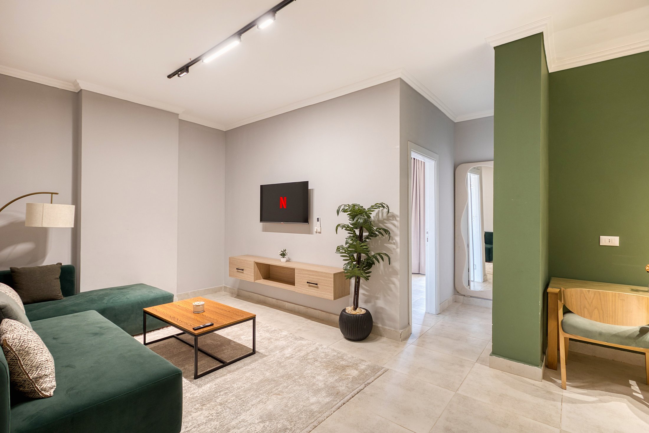 Travelholic Green Light 2BR with Balcony | Lotus 203 — Living Room in Travelholic Residence near Mivida. Unit 203., Egypt