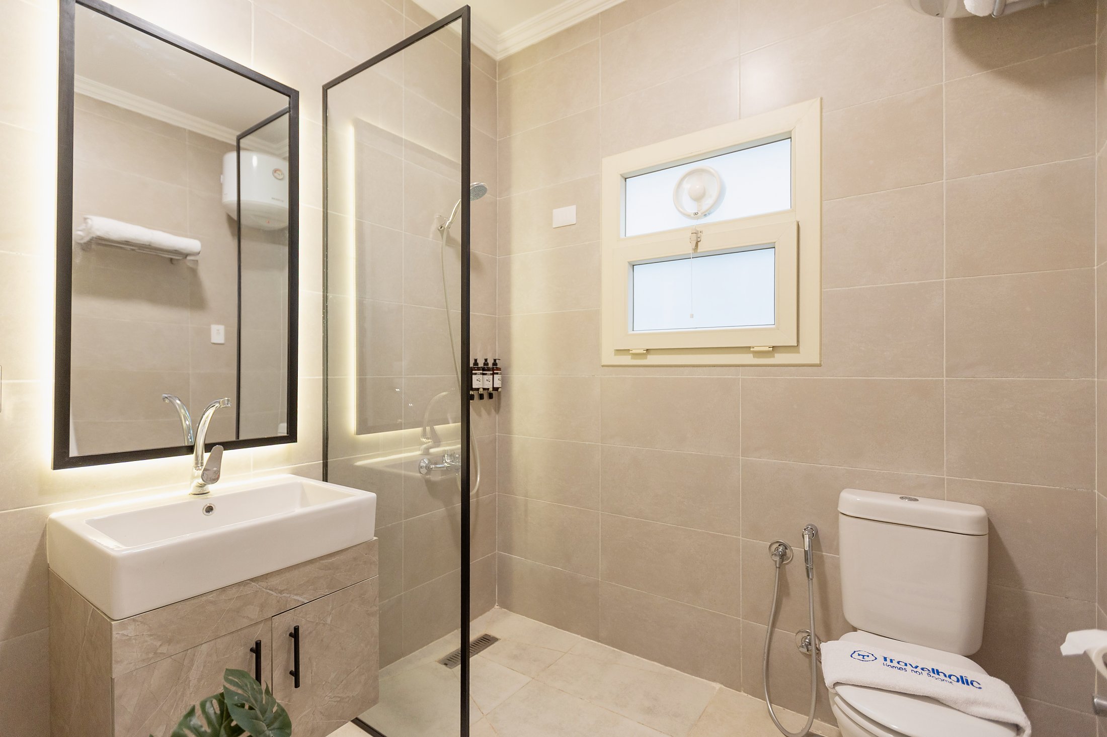 Travelholic Green Light 2BR with Balcony | Lotus 303 — Full bathroom 1 in Travelholic Residence near Mivida. Unit 303., Egypt — photo 2