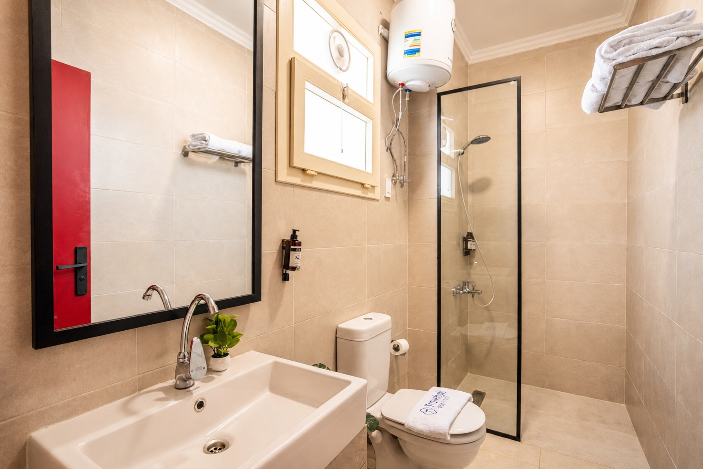 Travelholic Ruby 1BR with Balcony | Lotus 205 — Full bathroom 1 in Travelholic Residence near Mivida. Unit 205., Egypt — photo 2