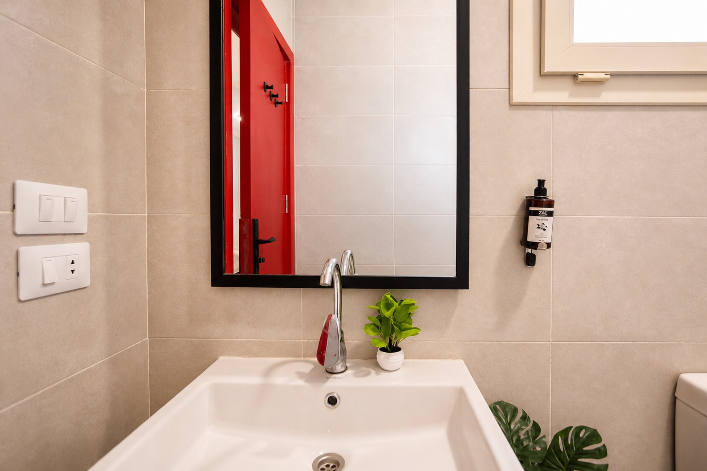 Travelholic Ruby 1BR with Balcony | Lotus 305 — Full bathroom 1 in Travelholic Residence near Mivida. Unit 305., Egypt
