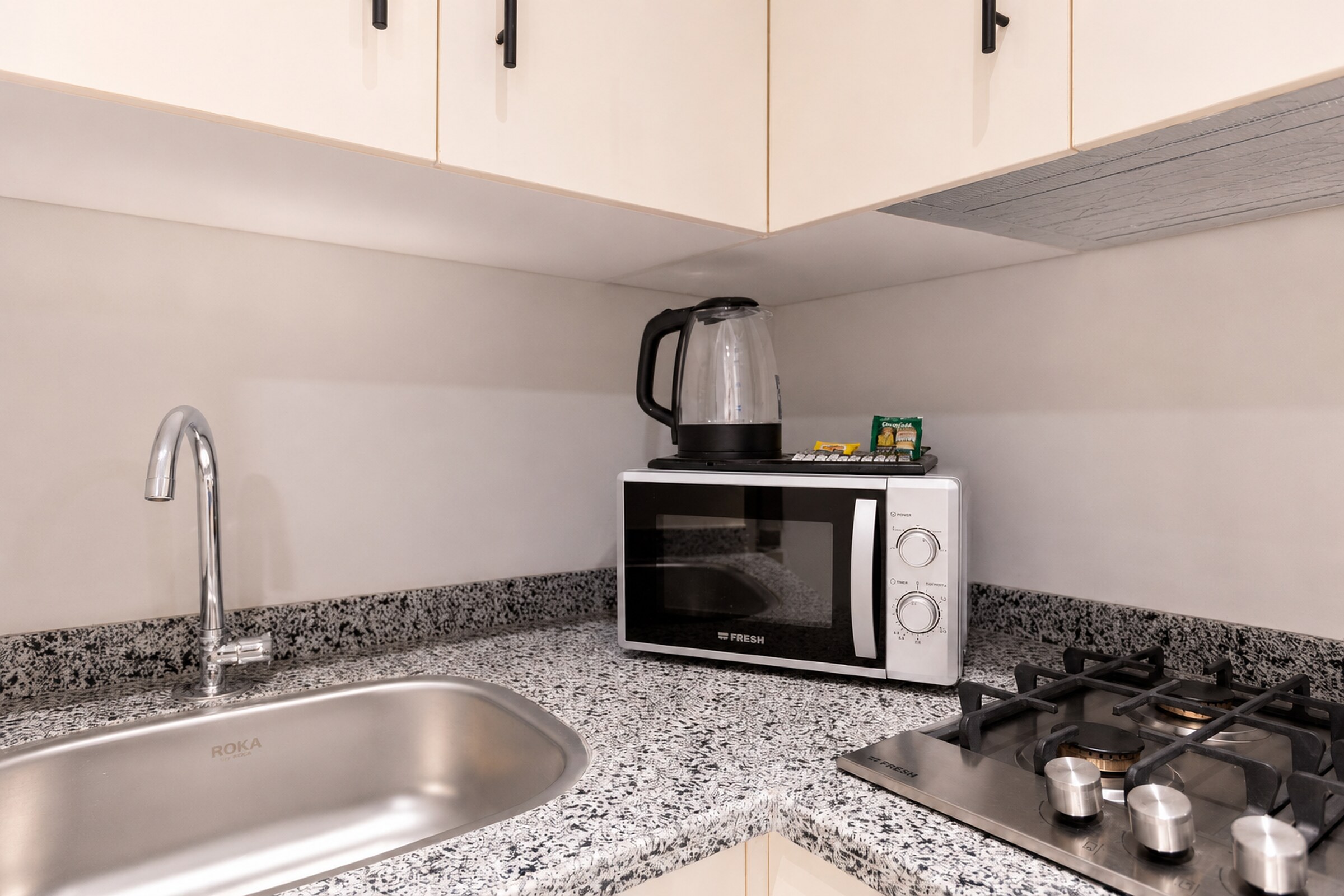 Travelholic Navy Nest 2BR Apartment | Lotus 306 — Full Kitchen in Travelholic Residence near Mivida. Unit 306., Egypt — photo 3