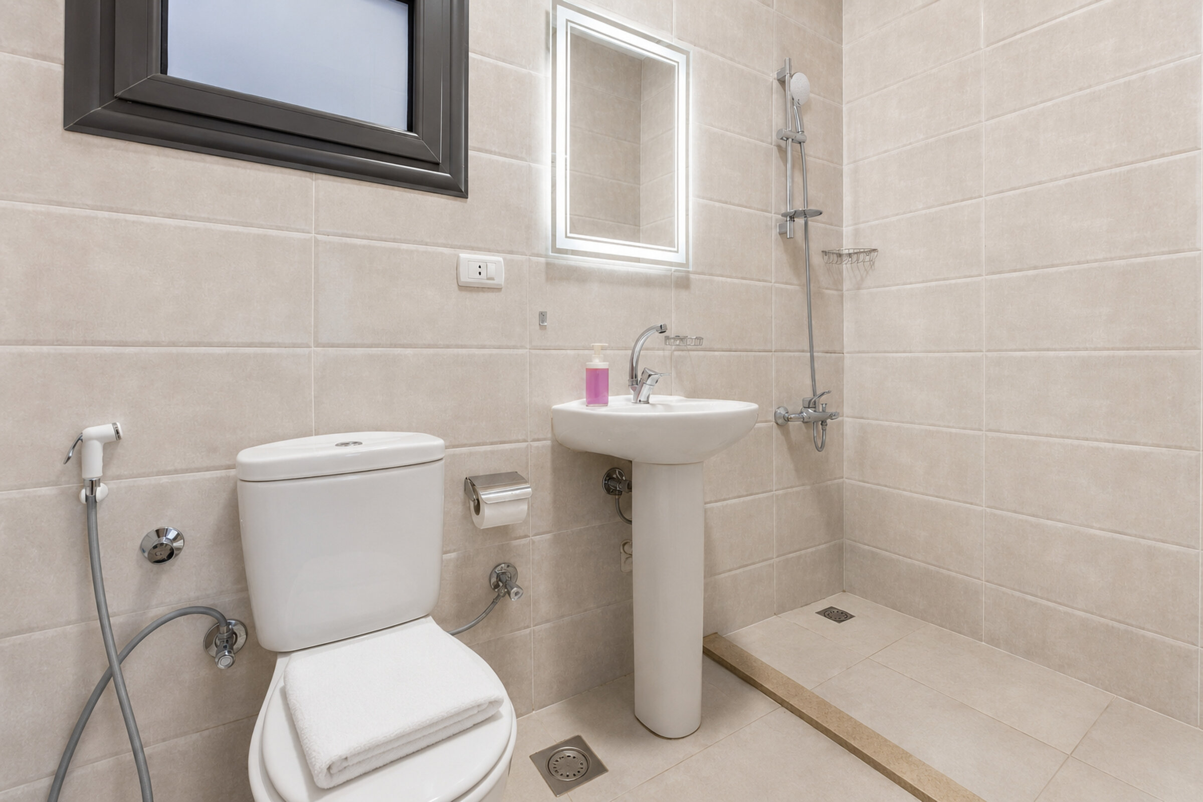 Travelholic Compact Twin Studio near AUC | AUC 301 — Full bathroom 1 in Travelholic AUC Residence. Unit 301., Egypt