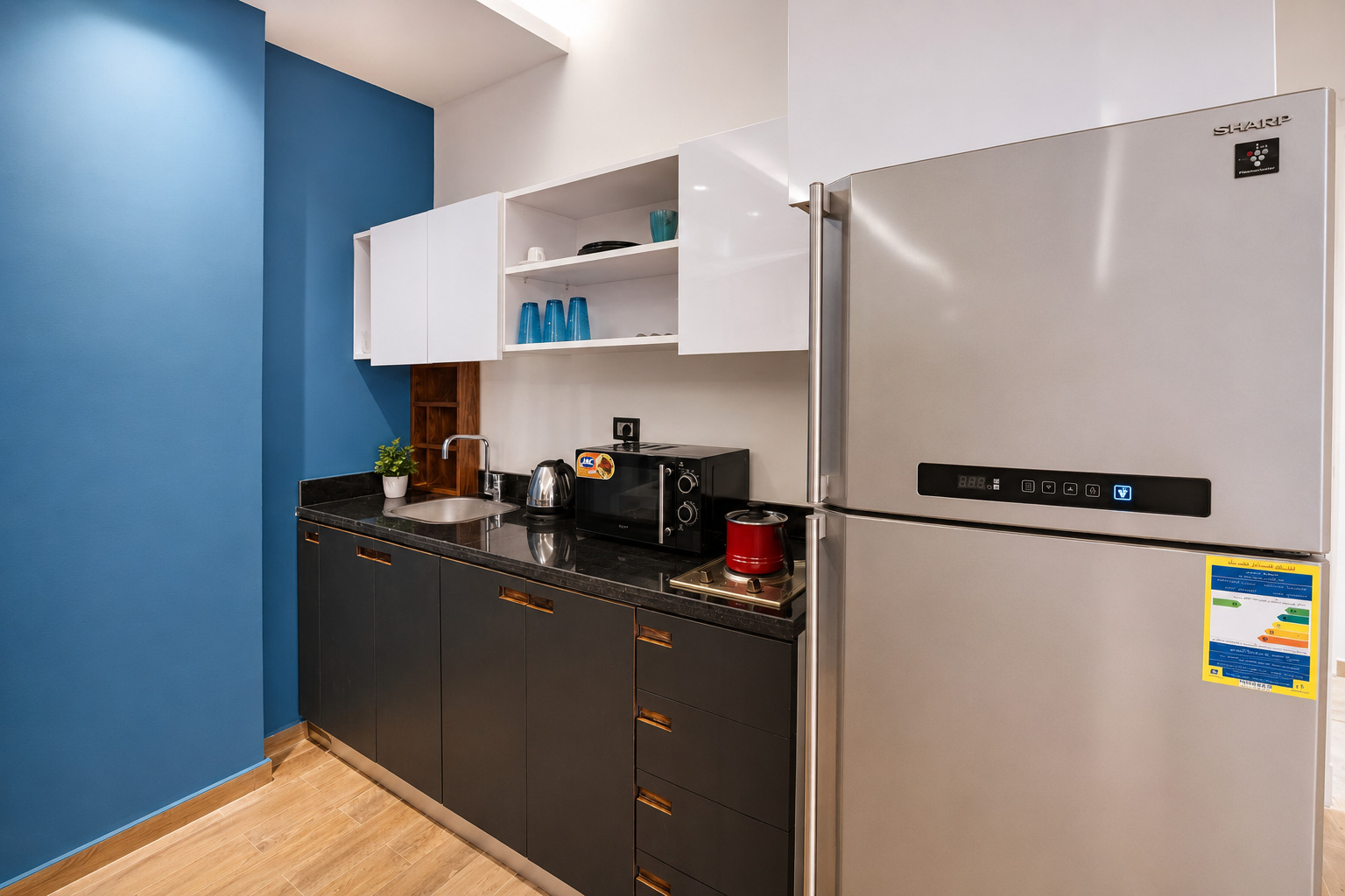 Travelholic Comfy Mega Studio near CFC | South Academy 104 — Full Kitchen in Travelholic New Cairo Residence. Unit 104., Egypt