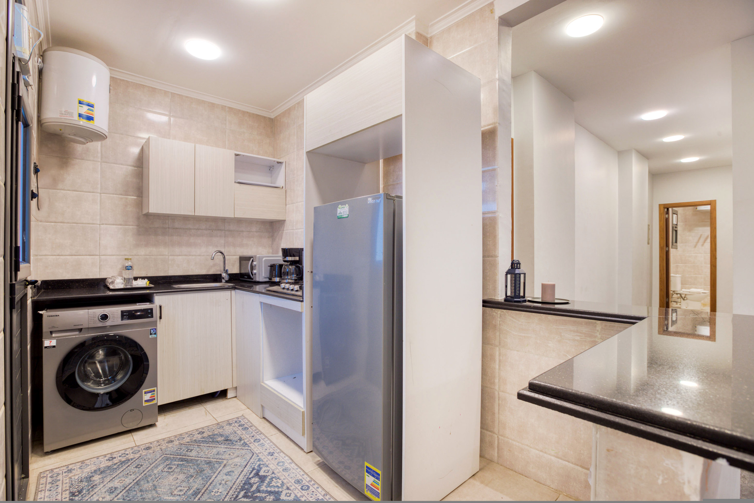 Travelholic Vista 3BR Apartment near AUC | AUC 101 — Full Kitchen in Travelholic AUC Residence. Unit 101., Egypt — photo 2