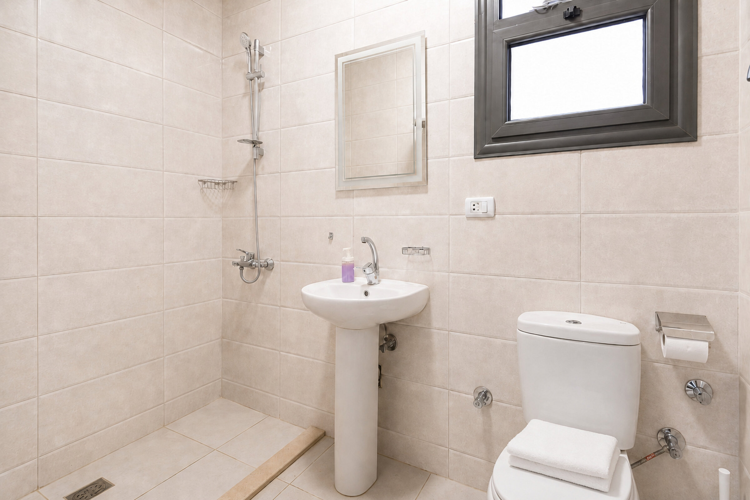 Travelholic Vista 3BR Apartment near AUC | AUC 101 — Full bathroom 1 in Travelholic AUC Residence. Unit 101., Egypt