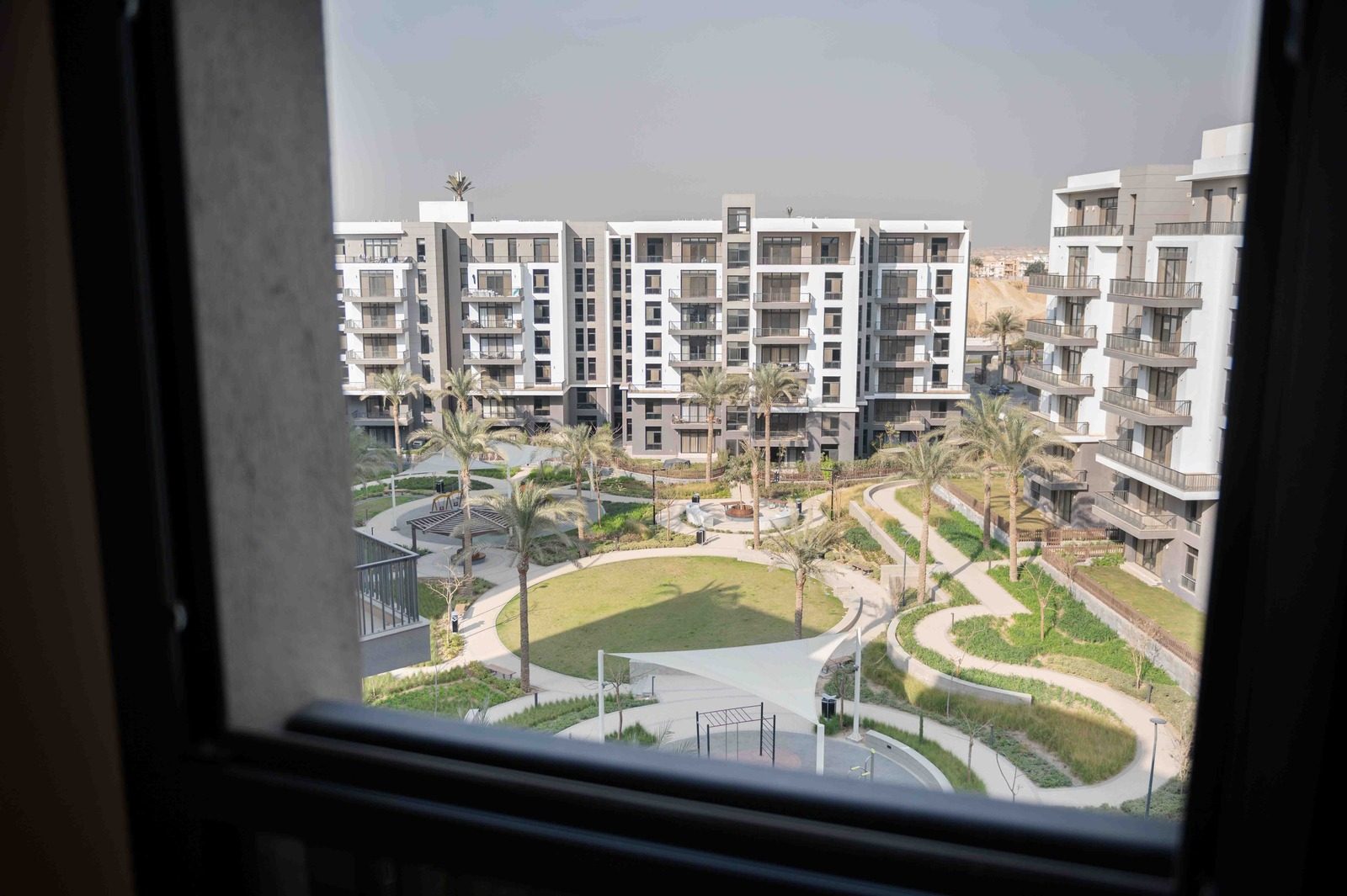 Vibrant 2BR Apartment – Garden View – CFC — Balcony in Aura, Cairo Festival City, Egypt