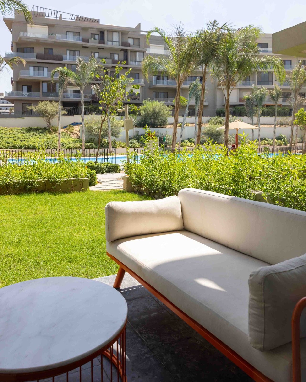 Refined 2BR Apartment – Pool View – SODIC — Patio in SODIC Villette, Egypt