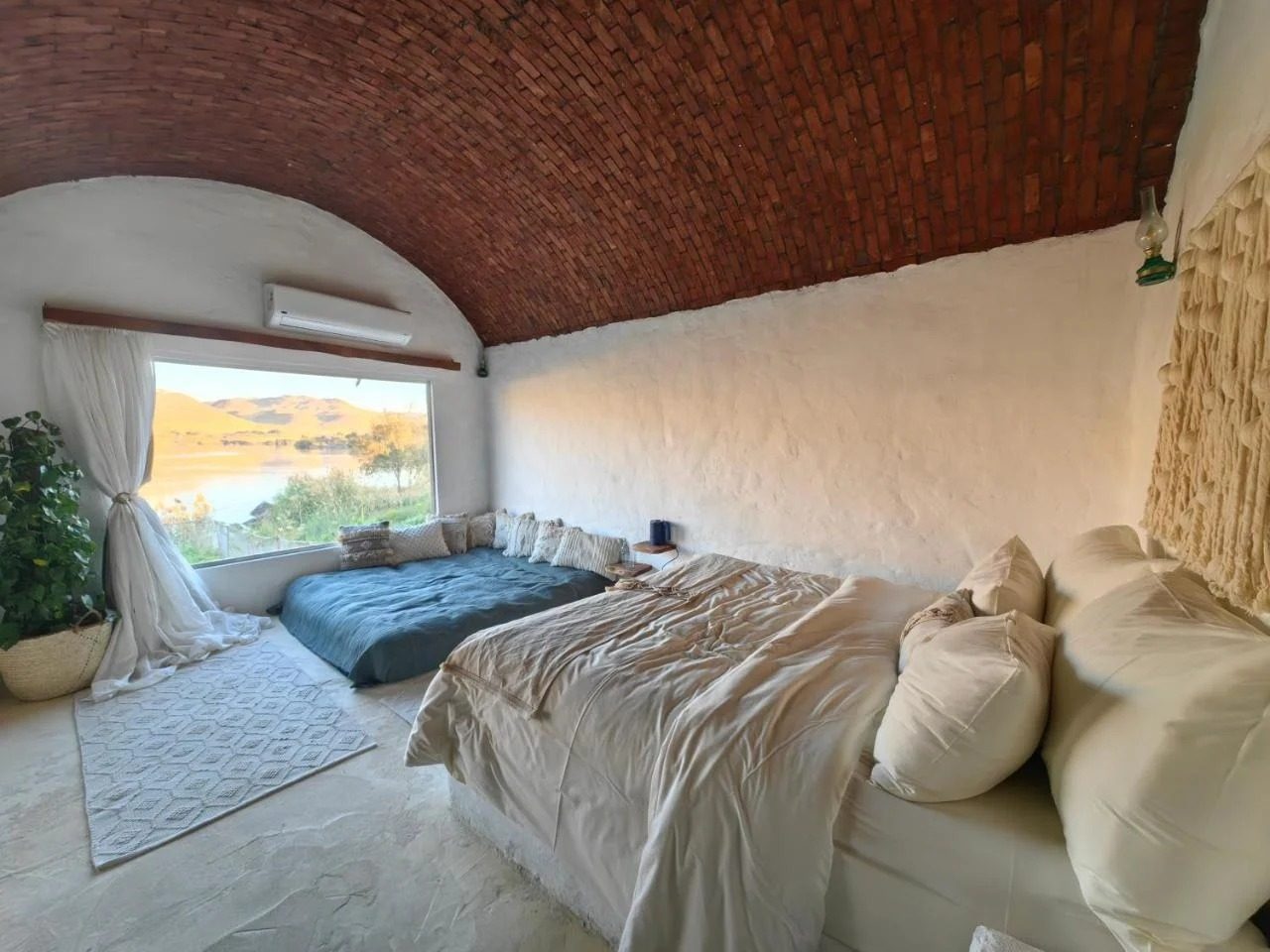 King Suite with Spa Bath – Nile View – Nubian Guesthouse, Aswan — Bedroom 1 in Nubian village on the West Bank of the Nile, Aswan, Egypt