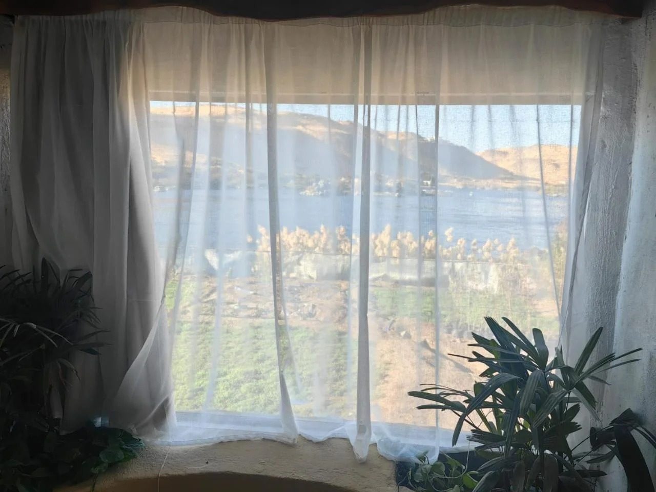 King Suite with Spa Bath – Nile View – Nubian Guesthouse, Aswan — Neighbourhood Preview in Nubian village on the West Bank of the Nile, Aswan, Egypt — photo 2