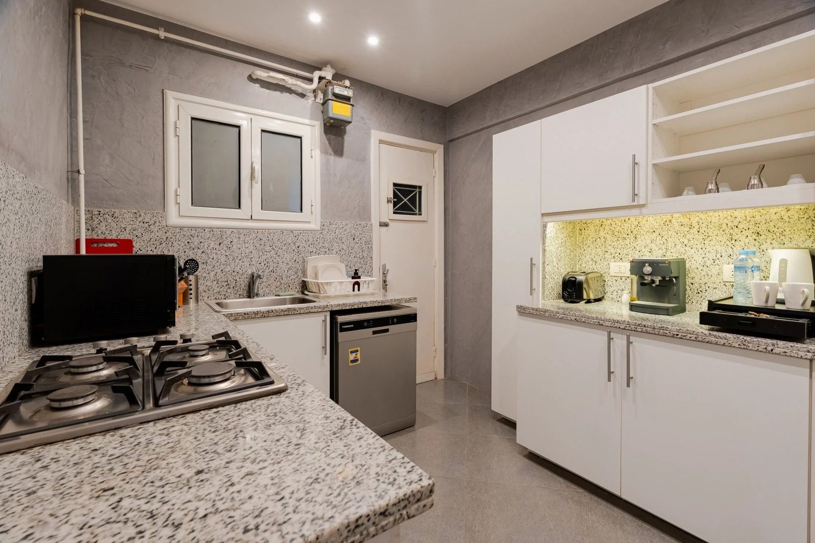 1BR Apartment with Balcony – City View – Zamalek — Full Kitchen in Zamalek, Cairo, Egypt