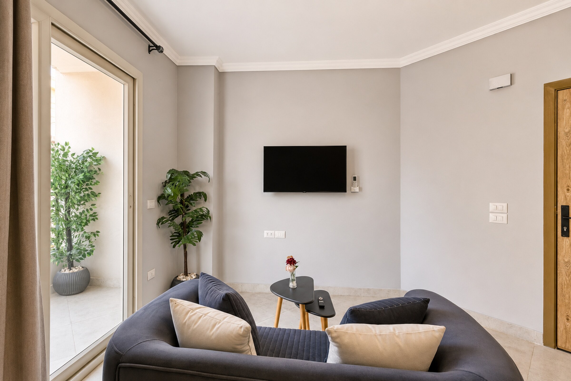 Travelholic Calm Corner 1BR with Balcony | Lotus 104 — Living Room in Travelholic Residence near Mivida. Unit 104., Egypt