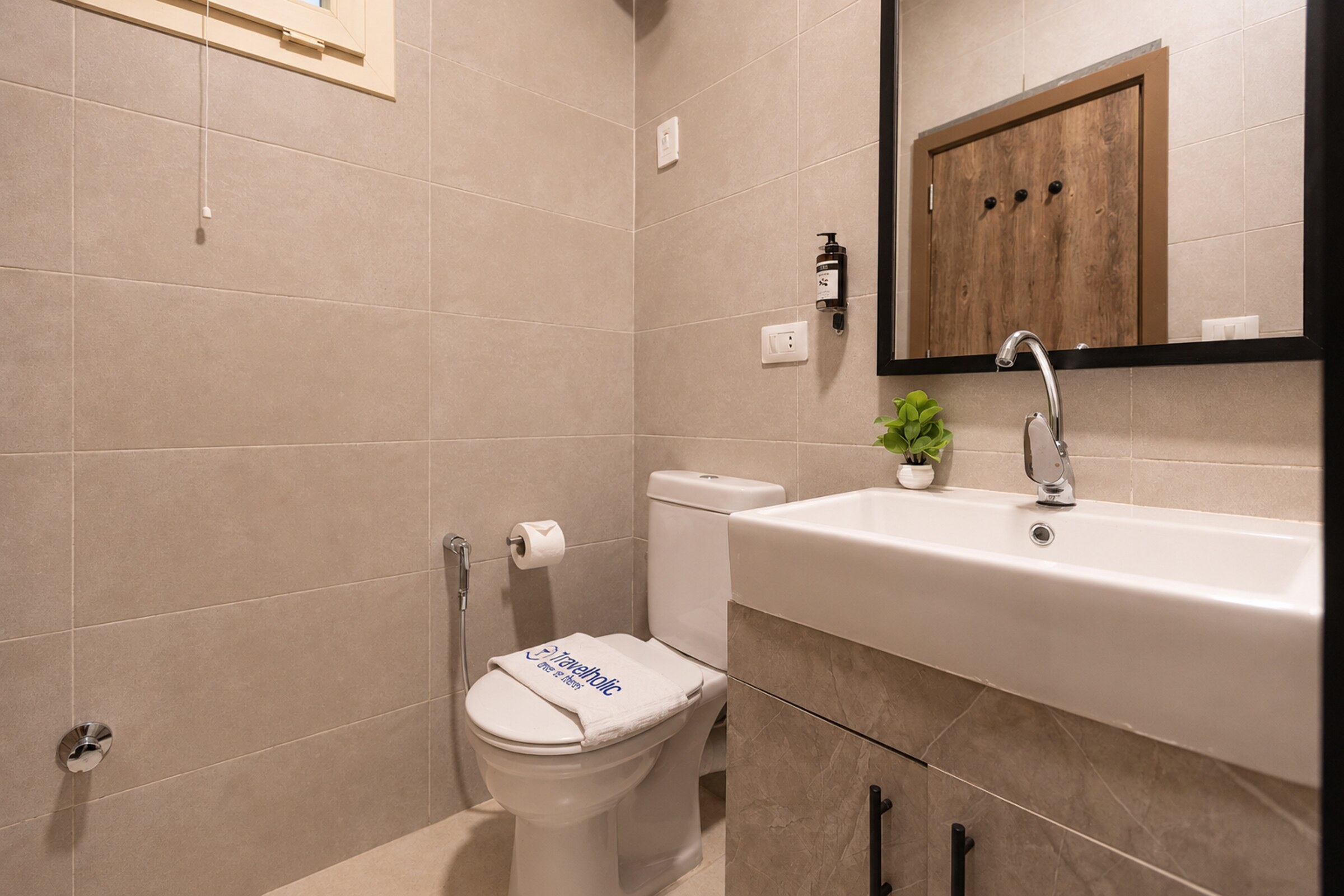 Travelholic Calm Corner 1BR with Balcony | Lotus 204 — Full bathroom 1 in Travelholic Residence near Mivida. Unit 204., Egypt — photo 3