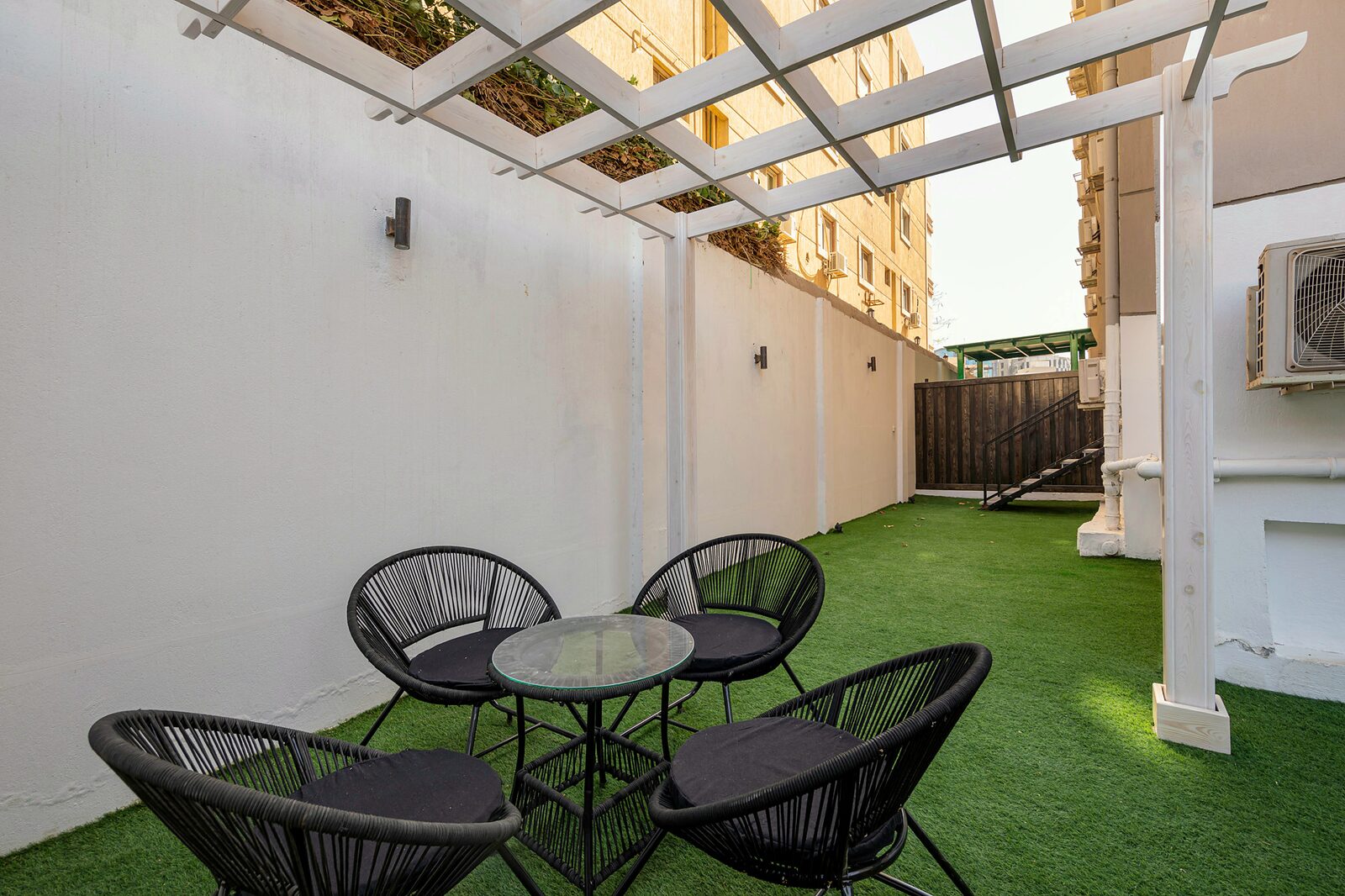 Travelholic Breeze Garden 2BR Apartment | 90 Residence 106 — Backyard in Travelholic 90st Residence. Unit 106., Egypt